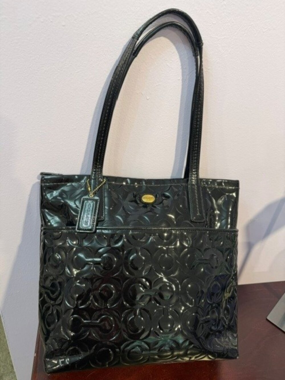 Gently used Coach Peyton embossed shiny black patent leather tote Style: F26901